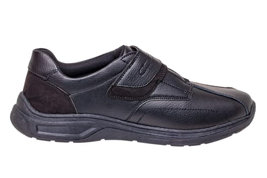 Mans black shoes. Close-up of a single of black sneakers or sport shoes isolated on a white background. Clipping path. Elegant and trendy mens footwear. Macro.