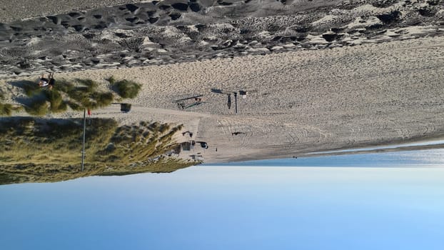 View over the sea from the dune over North Sea and canal in Ouddorp, Zeeland province, The Netherlands. Outdoor scene of coast in Europe nature.