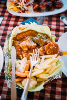 Goa, India. Dish Of Indian National Cuisine Is Sizzler, Which Consist Of French Fries, Fried Shrimp In Sauce, Fried Vegetables. Traditional Dish Of Goa.