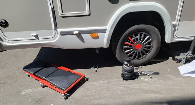 VELBERT, NRW, GERMANY - June 16, 2022:..Installation of an additional air suspension in a mobile home to increase the load capacity