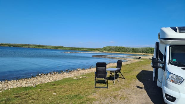 View over the sea from the dune over North Sea and canal in Ouddorp, Zeeland province, The Netherlands. Outdoor scene of coast in Europe nature.