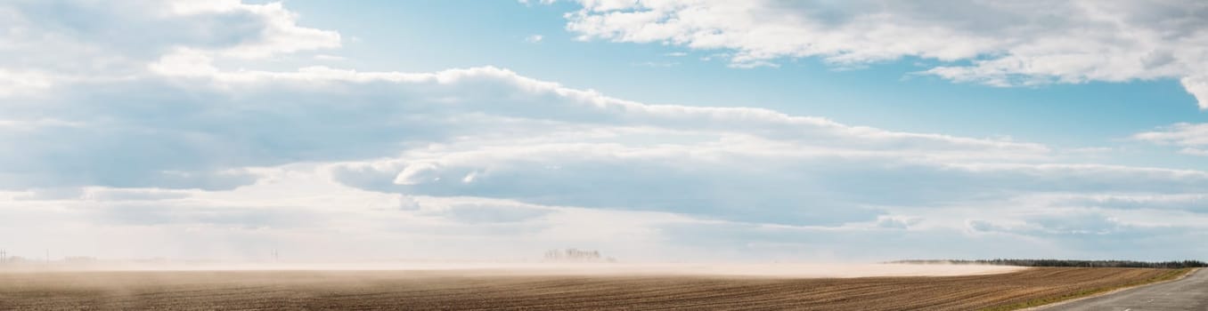 Belarus, Europe. Spring Dust Storm. A Dust Cloud From Agricultural Field Envelops Landscape.