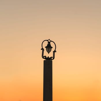 Glowing street lamp in the city