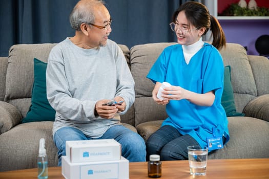 Woman nurse caregiver show prescription drug to senior man at nursing home, Doctor with physician visit senior male patient consult medicine dosage at house in living room, Healthcare worker support