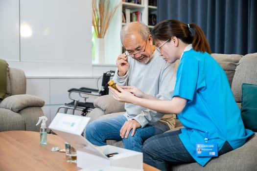 Woman nurse caregiver show prescription drug to senior man at nursing home, Doctor with physician visit senior male patient consult medicine dosage at house in living room, Healthcare worker support