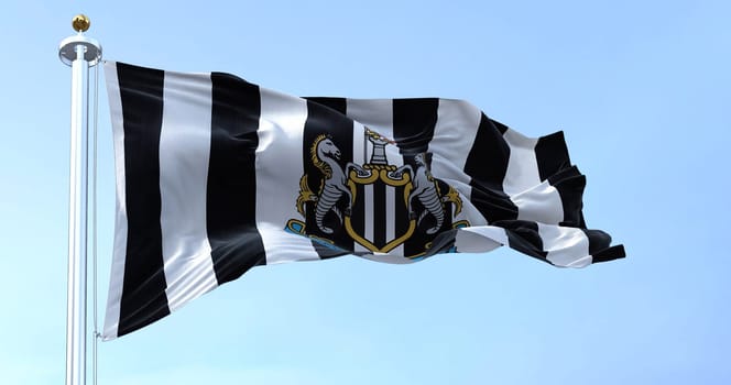 Newcastle, UK, May 2022: The flag of Newcastle United waving in the wind on a clear day. Newcastle United is an English professional football club