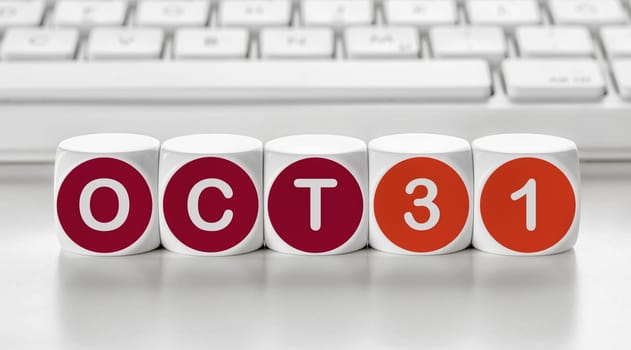 Letter dice in front of a keyboard - October 31