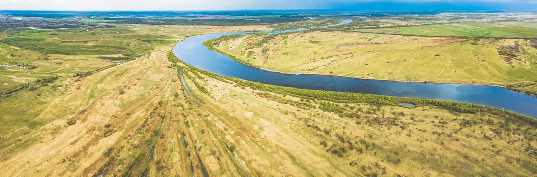 Rechytsa, Gomel Region, Belarus. Aerial View Of Dnieper River. Sky Above Green Meadow And River Landscape. Top View Of European Nature From High Attitude In Summer. Bird's Eye View. Panorama.