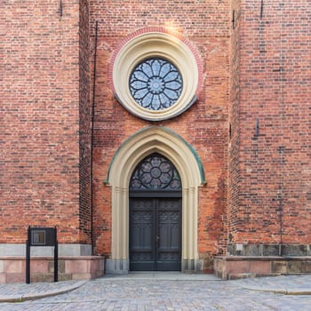 Entrance of Riddarholmen Church, located in the island of Riddarholmshamnen, old city, Gamla stan. before sunset in a summer day, Stockholm, Sweden