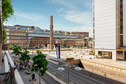 Stockholm, Sweden - June 26 2022: Sergel's Square or Sergels torg with Kulturhuset Stadsteatern, arts and culture center, and the superellipse shaped fountain, at Norrmalm district