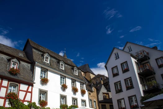 Beilstein - historic village along the river Moselle with old half-timbered houses and the ruins of castle Metternich on top of the hills, Germany