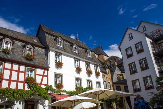 Beilstein - historic village along the river Moselle with old half-timbered houses and the ruins of castle Metternich on top of the hills, Germany