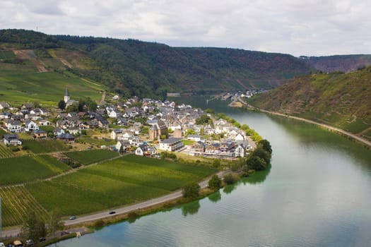 Aerial view of the Moselle valley with vineyards, the river Moselle and the villages Ellenz-Poltersdorf and Poltersdorf seen from castle Metternich in Beilstein, Rhineland-Palatinate, Germany.