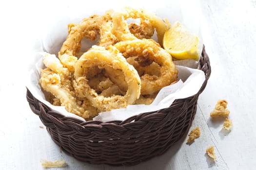 close up of basket of golden italian fried calamari