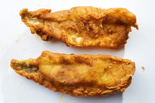 close up of traditional golden english fish and chips