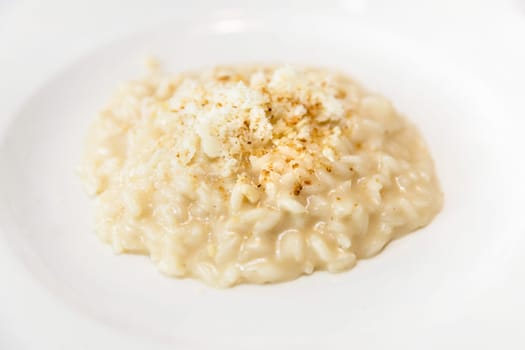 Carnaroli rice parmigiana with Castelmagno and bread crispy.