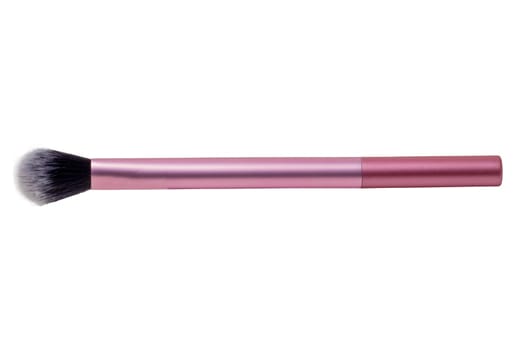 Makeup brushes. Selective focus on an elegant pink professional make-up brush isolated on a white background. Concept beauty. Macro.