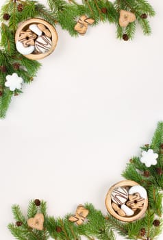 Christmas tree made from fir branches, red stars and a cinnamon stick as the trunk, greeting card with copy space