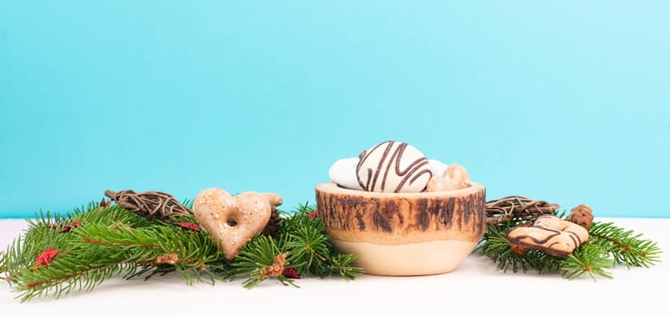 Nurnberg elisen gingerbread mix, traditional german christmas sweets with fir branches and pine cones, holiday background with copy space