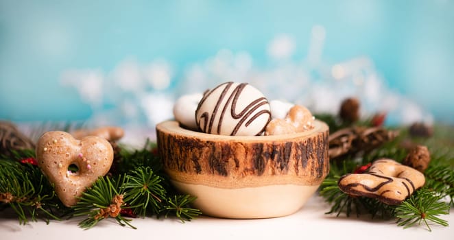 Nurnberg elisen gingerbread mix, traditional german christmas sweets with fir branches and pine cones, holiday background with copy space