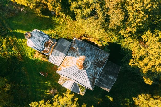 Martinovo, Beshenkovichsky District, Vitebsk Region, Belarus. Bird's-eye View Of Church Of The Intercession Of The Most Holy Theotokos. Aerial View Of Historic Landmark In Autumn Sunny Evening. Flat View.