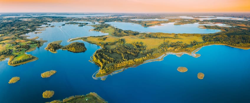 Braslaw Or Braslau, Vitebsk Voblast, Belarus. Aerial View Of Nedrava Lake And Green Forest Landscape In Sunny Summer Morning. Top View Of Beautiful European Nature From High Attitude. Bird's Eye View. Panorama. Famous Lakes. Natural Landmarks.
