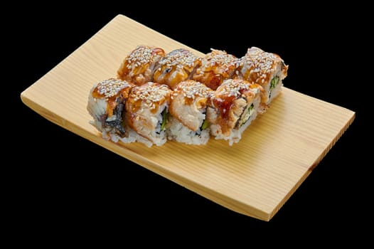 delicious Canada rolls on a wooden stand on a black isolated background. High quality photo