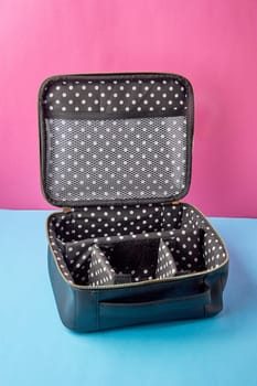 empty open black cosmetic bag close-up. High quality photo