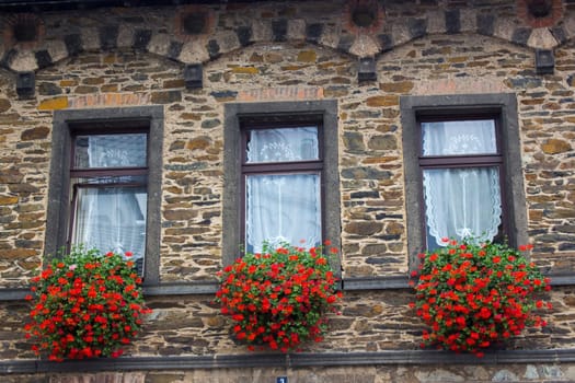 Old Building in Treis-Karden, windows with flowers, Rheineland-Palatinate, Germany