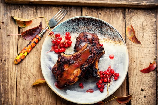 Delicious pork steak roasted with berry sauce.Copy space