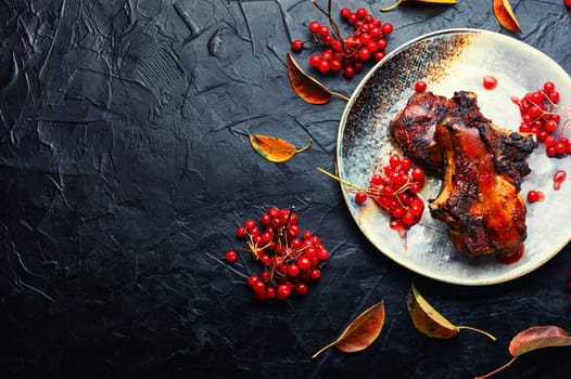 Delicious pork steak roasted with berry sauce.Copy space