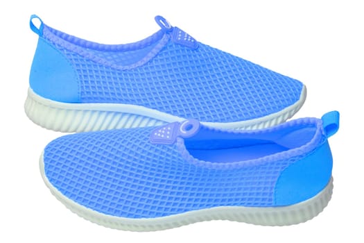 Blue sneaker isolated. Close-up of women's trendy athletic shoes or sport sneakers isolated on a white background. Modern footwear design for workout. Macro.