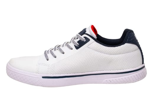 White sneakers isolated. Close-up of a single white elegant stylish leather sport shoe isolated on a white background. Modern design footwear for workout. Macro.