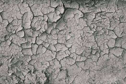 Background Of Dry Cracked Soil Dirt Or Earth During Drought. Dry Cracked Earth Depicting Severe Drought Conditions.