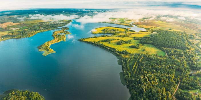 Lyepyel District, Lepel Lake, Beloozerny District, Vitebsk Region. Aerial View Of Residential Area With Houses In Countryside. Morning Fog Above Lepel Lake. Top View Of European Nature From High Attitude In Autumn. Bird's Eye View Of Old Lyepyel Cityscape Skyline.