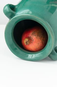 A pomegranate inside clay earthen ware