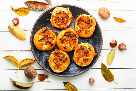 Autumn homemade pastries.Fresh buns with minced meat and pumpkin.