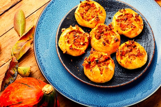 Autumn homemade pastries.Fresh buns with minced meat and pumpkin.
