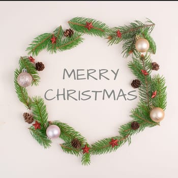 Merry christmas holiday background, frame with fir branches, baubles and cones, winter season greeting card