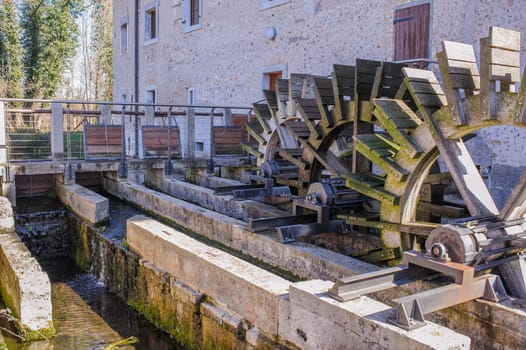 Series of three wheeled wooden mill renovated