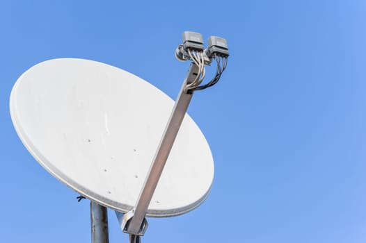 Satellite dish the background of a blue sky