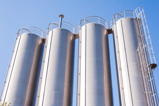 Detail of chemical plant, silos and pipes