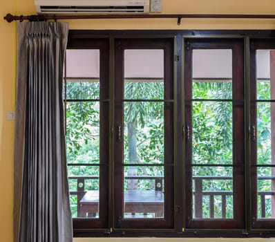 Closed glass window with curtain