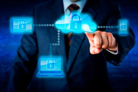 Torso of a business man in blue suit reaching forward to touch a cloud icon with index finger and lock mobile devices. Smart phone, laptop and tablet PC are in the cloud network. Technology metaphor.