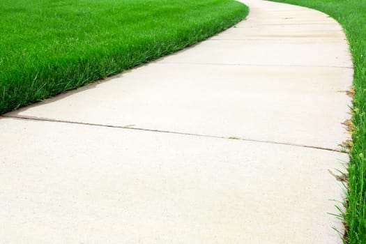 Pathway through green lawn
