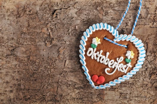 original bavarian oktoberfest gingerbread heart in real brown tree bark\n