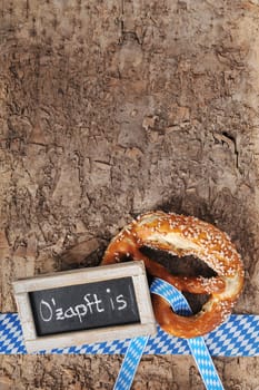 original Bavarian lye pretzels with table on real brown tree bark