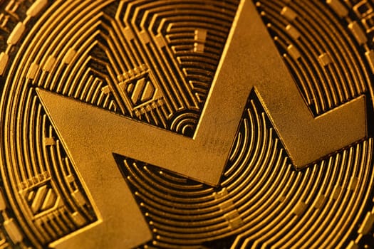 top view extreme macro closeup of crypto Monero golden coin logo symbol