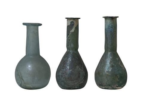 front view closeup of three weathered antique roman glass bottle vials with long neck isolated on white background