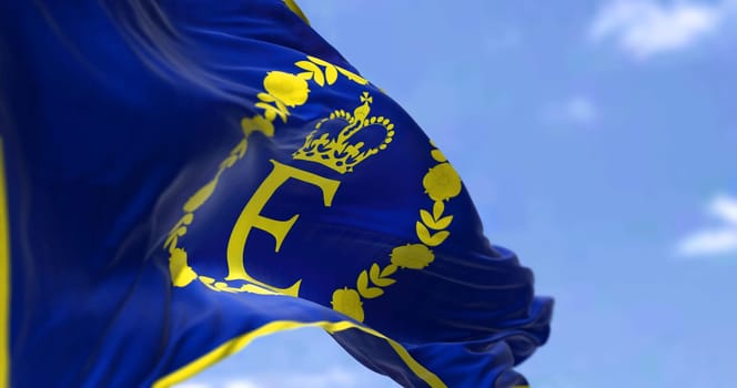 the personal flag of Queen Elizabeth II flying in the wind. Tradition and British monarchy